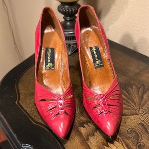 New red leather pumps